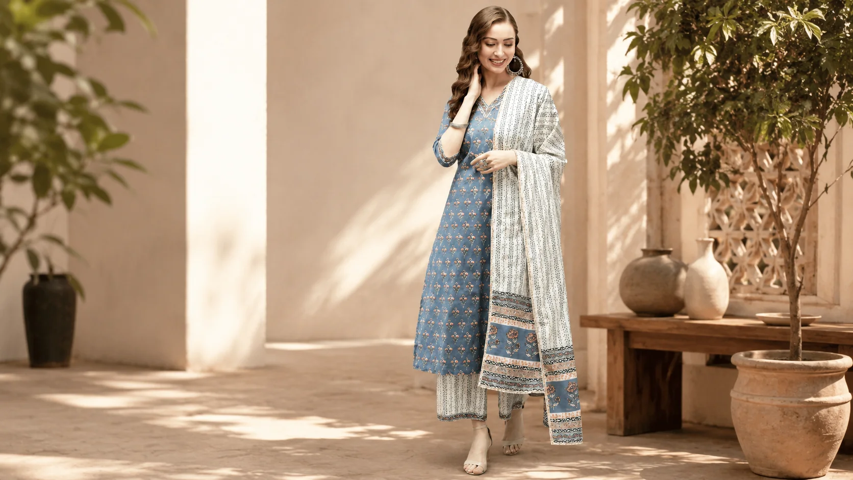 Woman wearing a blue cotton printed kurta set with palazzo trousers and coordinating dupatta for blue cotton kurta set styling inspiration.