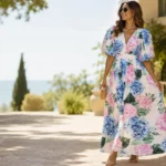Woman wearing a pink and blue floral maxi dress styled for an elegant spring or summer occasion
