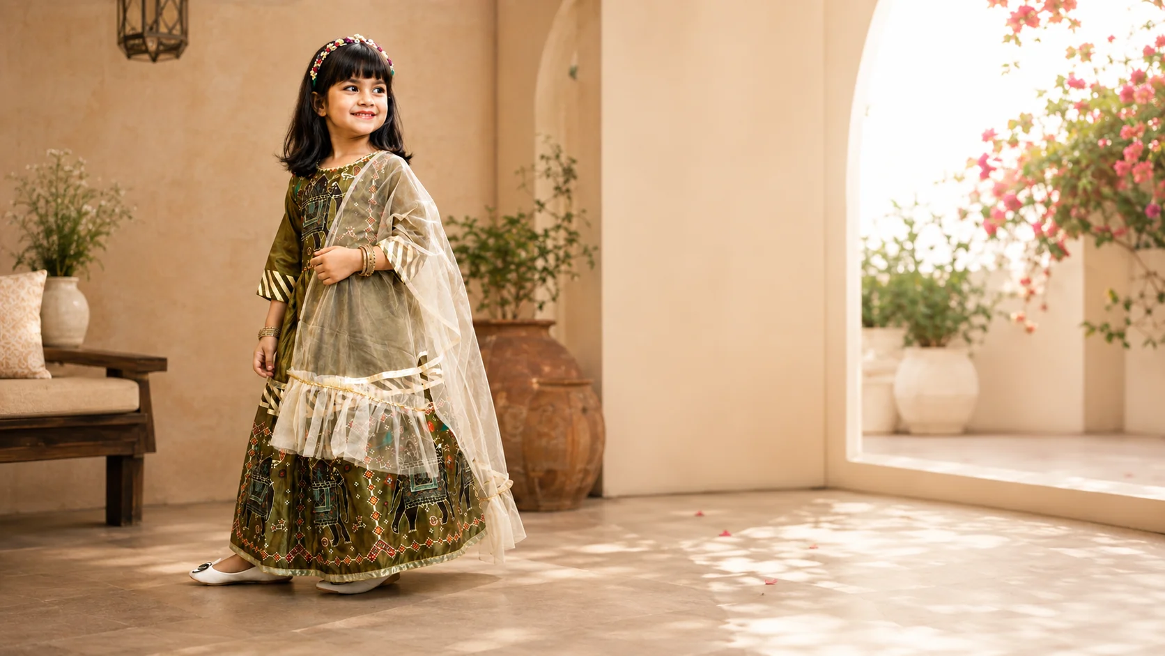 Olive girls ethnic outfit with patterned motifs and light drape styled as festive children's fashion inspiration