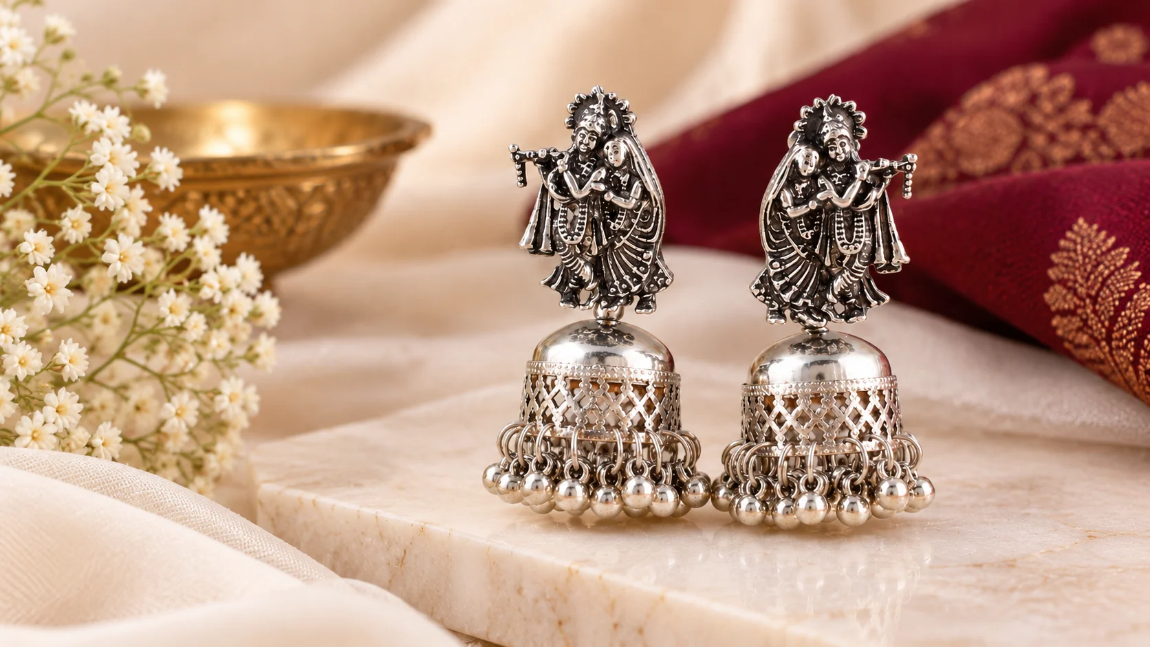 Ornate oxidised jhumka earrings with sculptural figure motifs and dangling details styled for oxidised jhumka earrings inspiration.