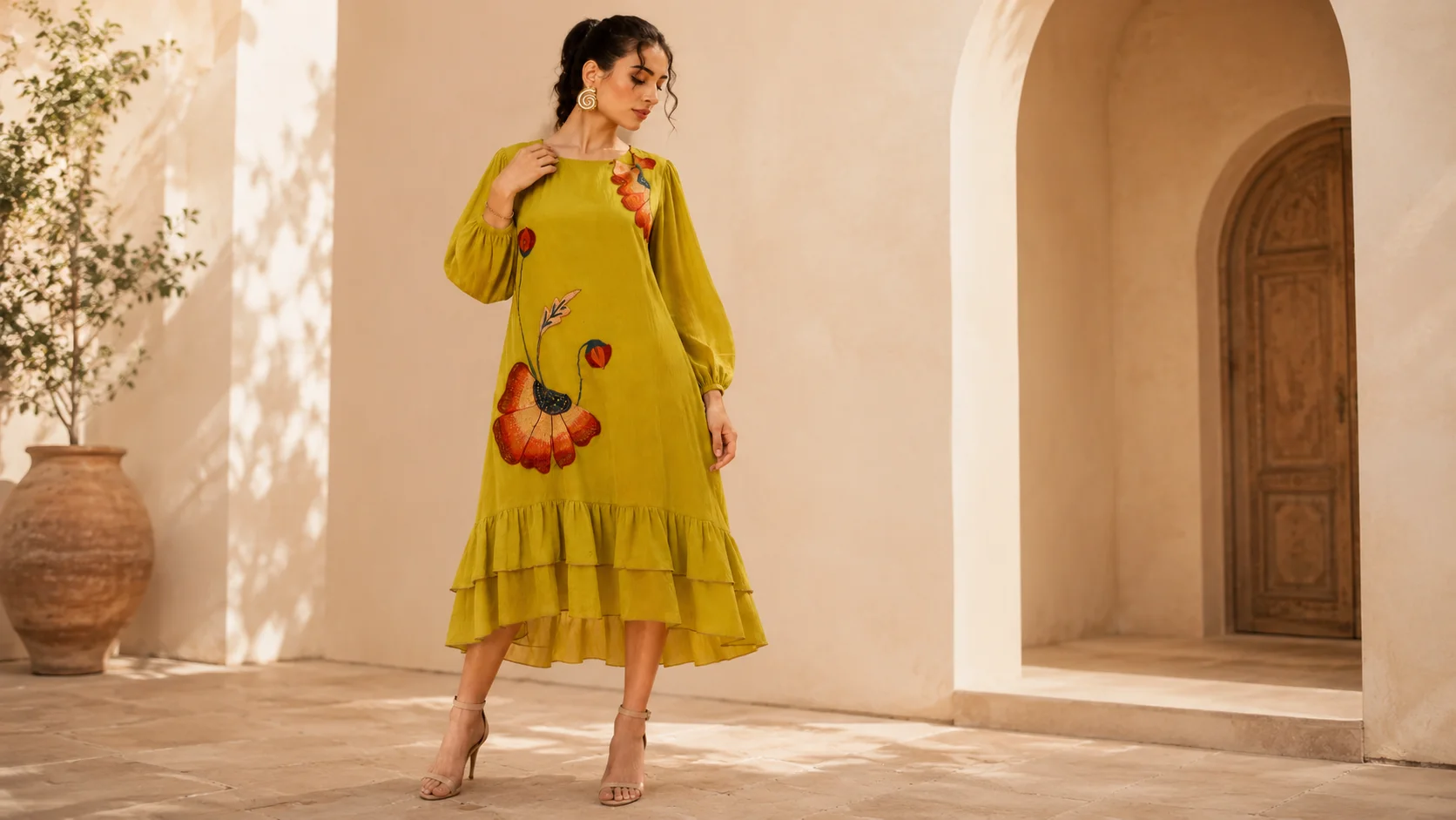 Woman wearing a colourful floral statement dress styled for statement dress styling ideas and modern feminine outfit inspiration.